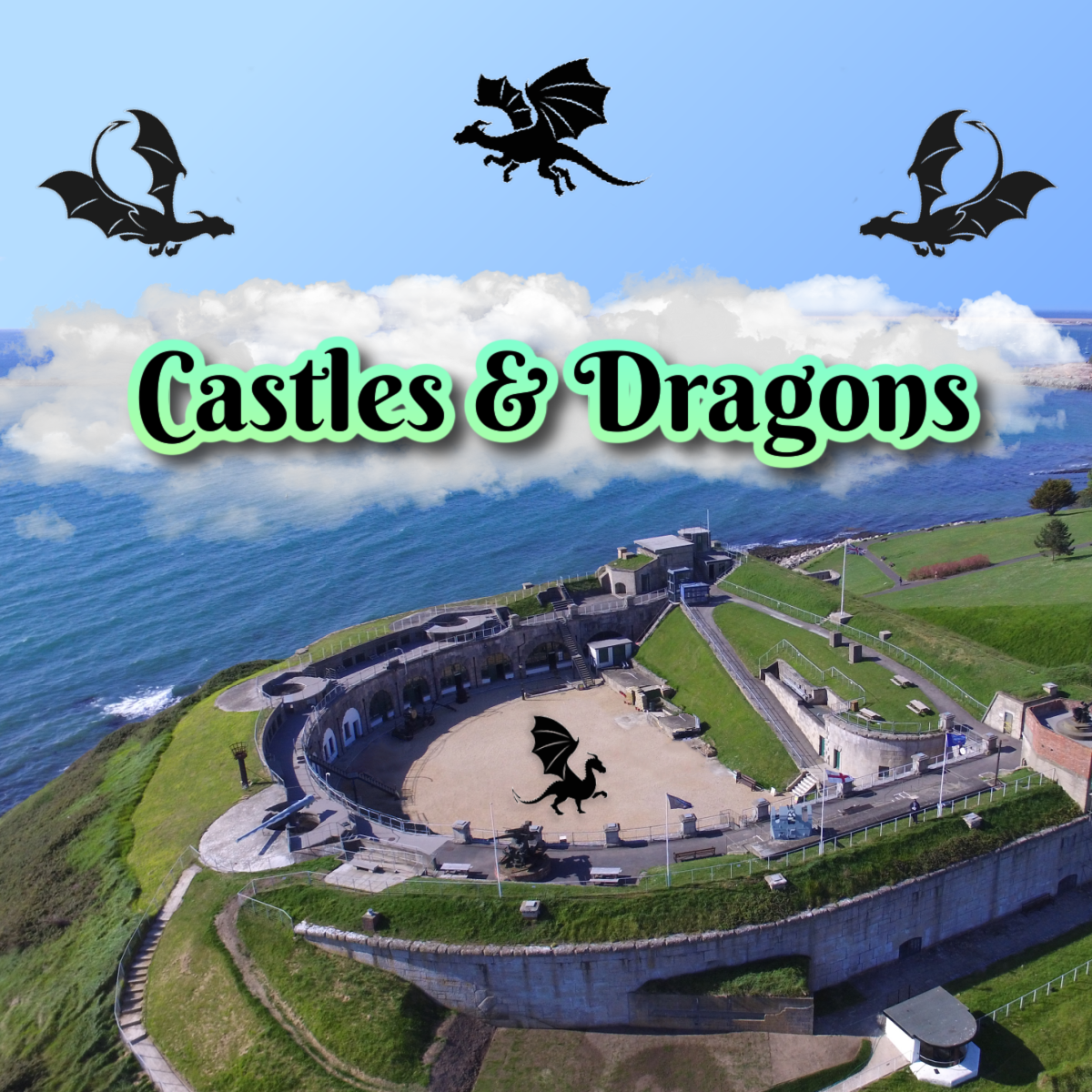 An aerial photograph of the Nothe Fort on a sunny day, showing rolling green hills and grey stone walls. In the upper third of the photo is a band of white clouds and in front of that is Black text with a lime green outline that reads 'Castles and Dragons'. In the blue sky at the top of the photo, are three black dragon silhouettes.