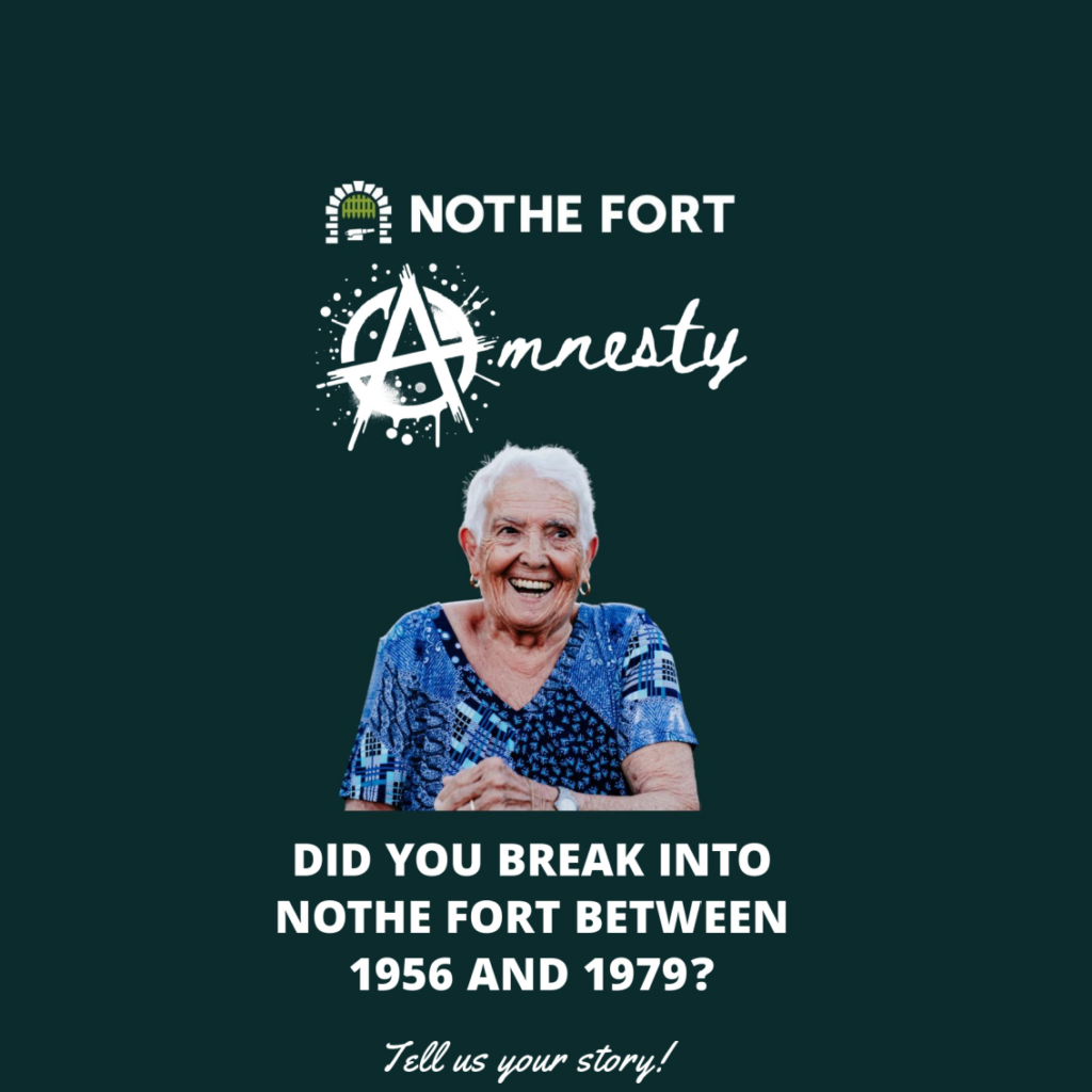 A tile sized image with a WHITE font that reads 'AMNESTY' with the A resembling the Anarchy symbol. There is a photo in the centre of an older woman in a blue top smiling with a cheeky grin. The text beneath reads: Did you break into Nothe Fort between 1956 and 1979? Tell us your story!