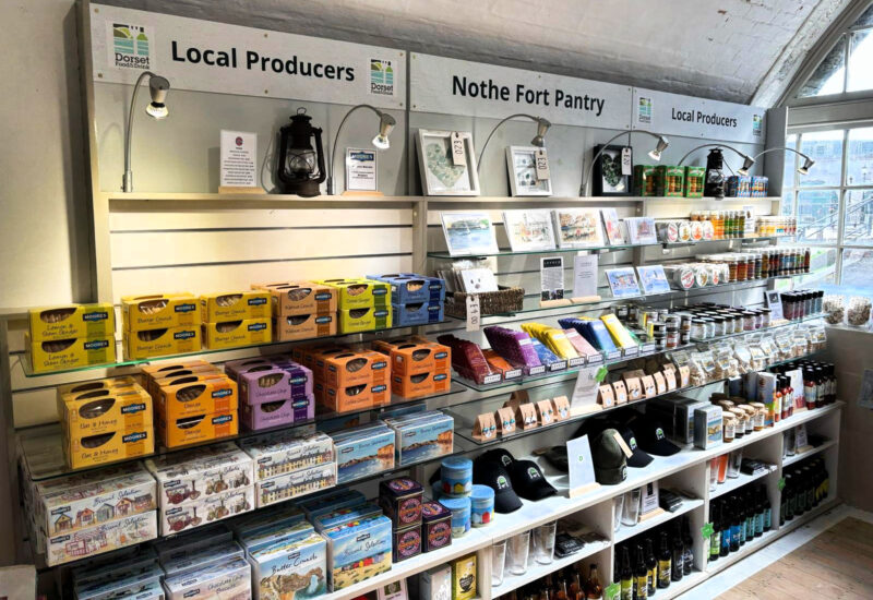 A photo of our Nothe Fort Pantry shelves featuring gift products sourced from local producers.