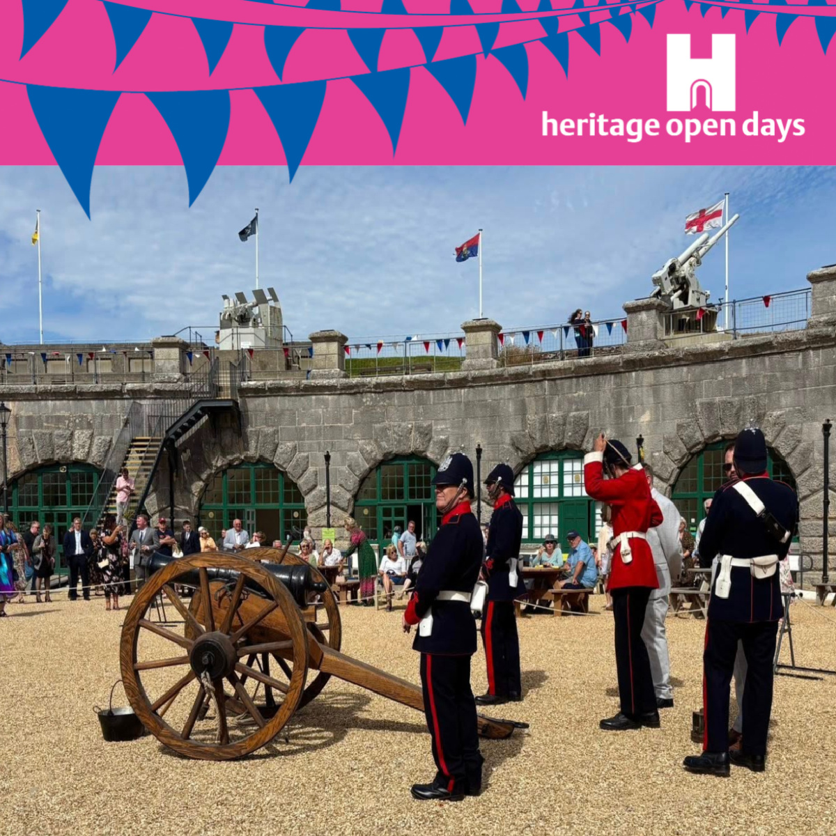 A square image of a photo of the Artillery in Nothe Fort posing with their cannon. Above the blue sky of the image is a bright pink banner with blue bunting across the logo. In the right hand corner of the pink header is the white heritage open days logo.