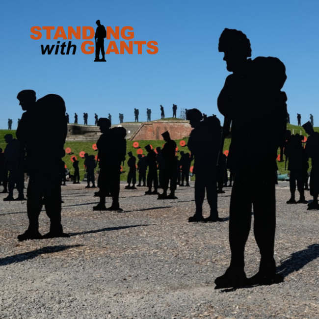 A photo of an outdoor parade ground at Fort Nelson with many metal framed soldier silhouettes that mark the lives lost in the Falkland's conflict.