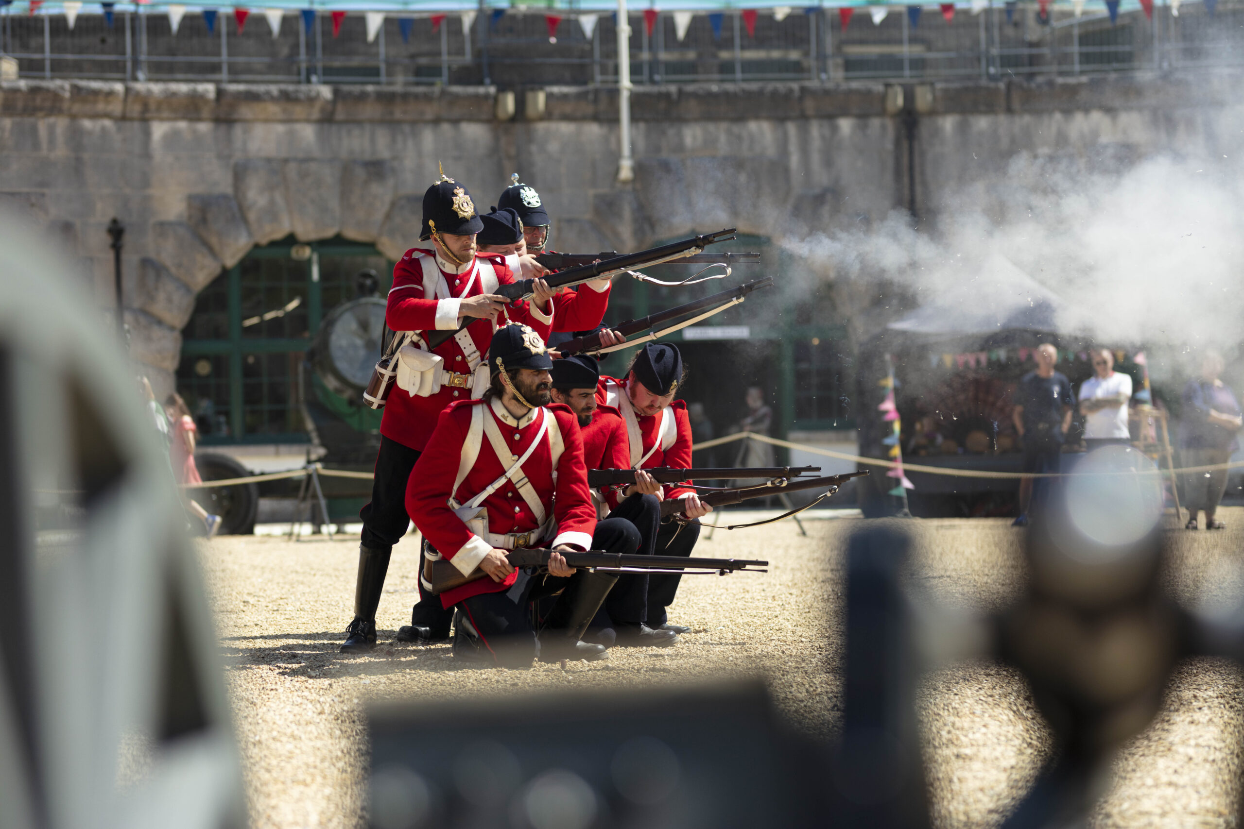 A photo of the Nothe Fort Garrison The Dorsetshire Regiment firing their artillery guns in the Parade Ground.