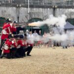 A photo of the Nothe Fort artillery firing muskets in the parade ground.