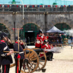 A photo of the Nothe Fort Garrison The Dorsetshire Regiment firing their artillery cannons and guns in the Parade Ground.