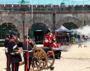A photo of the Nothe Fort Garrison The Dorsetshire Regiment firing their artillery cannons and guns in the Parade Ground.