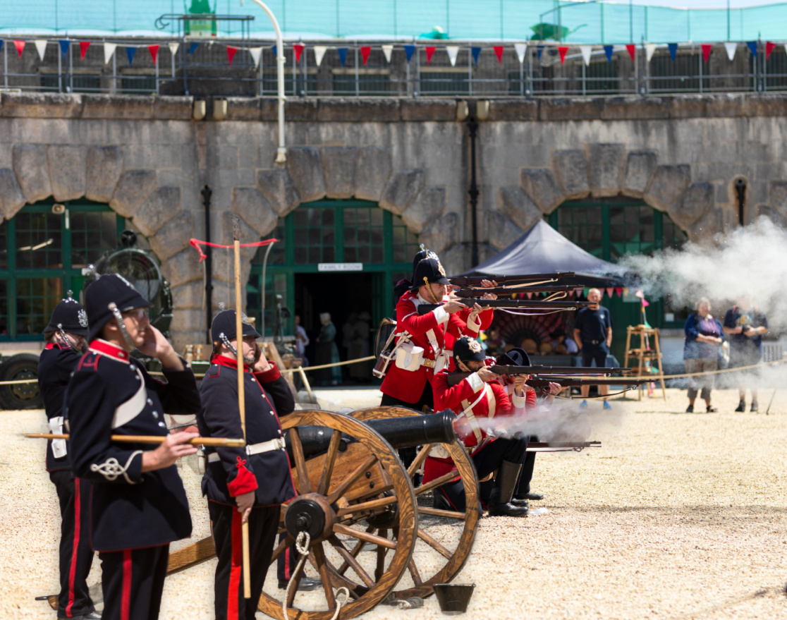 A photo of the Nothe Fort Garrison The Dorsetshire Regiment firing their artillery cannons and guns in the Parade Ground.