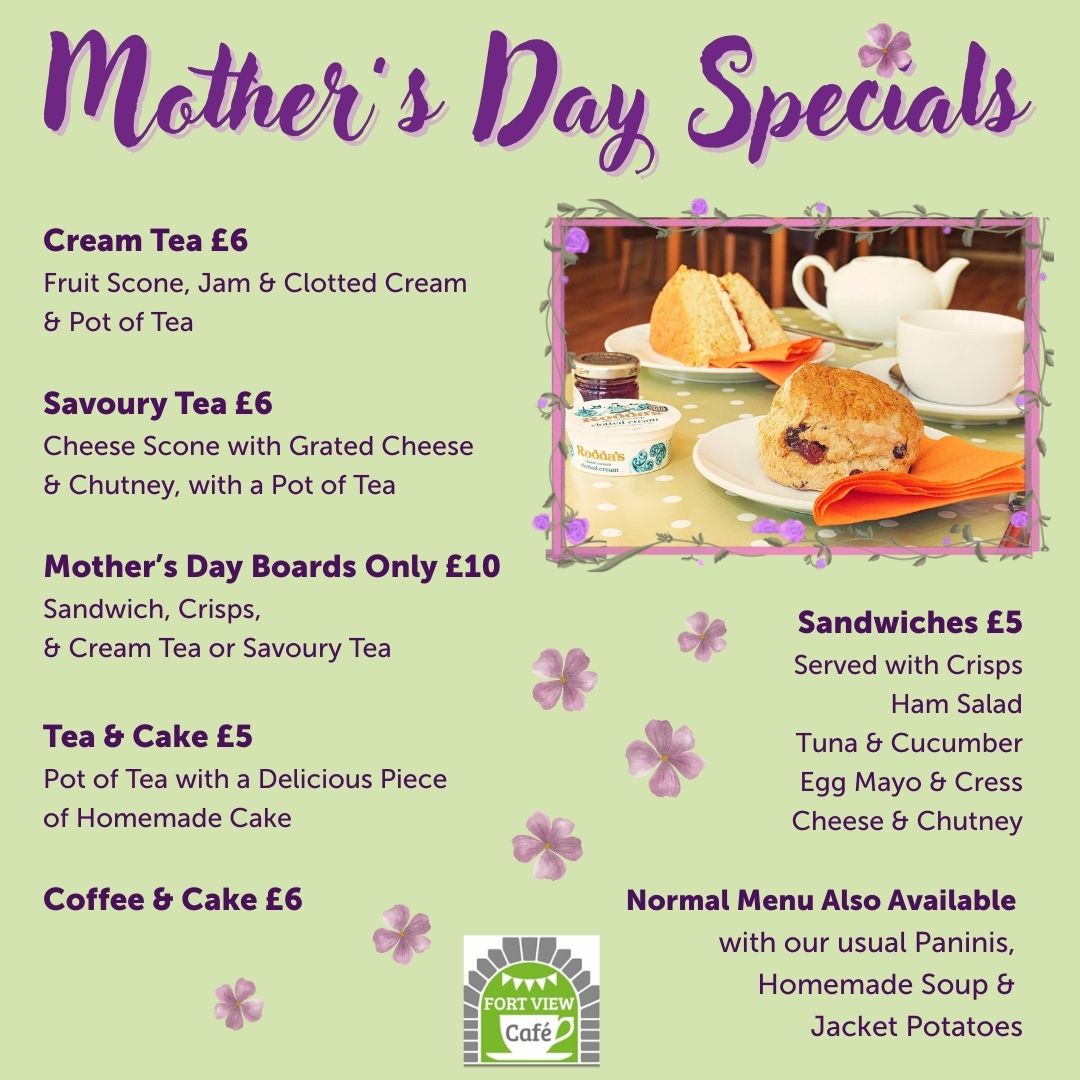 A promotional poster titled “Mothers Day Specials” with a purple floral theme. The poster lists menu items and prices from Fort View Café, including cream tea, savoury tea, Mother’s Day boards, tea and cake, coffee and cake, and sandwiches. A photo on the right shows a table with scones, jam, clotted cream, a teapot, and cups. The café logo is at the bottom. The background is light yellow with scattered purple flowers.