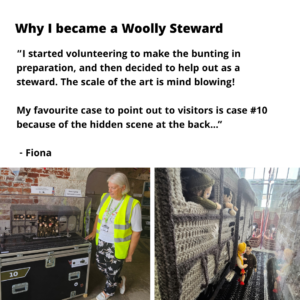 A photo of Fiona, a steward in a hi-viz yellow jacket standing beside their favourite knitted scene of a train of soldiers. The text reads ' why i became a woolly steward: “I started volunteering to make the bunting in preparation, and then decided to help out as a steward. The scale of the art is mind blowing! My favourite case to point out to visitors is case #10 because of the hidden scene at the back...” - Fiona